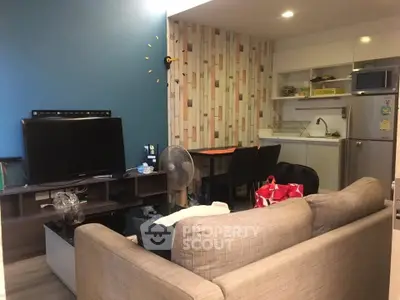 Cozy living room with modern kitchen in open layout apartment