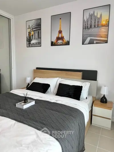 Modern bedroom with stylish decor and elegant wall art