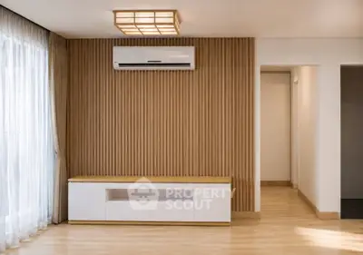 Modern living room with wooden panel wall and air conditioning unit