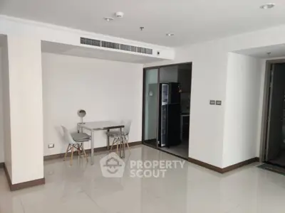 Spacious modern apartment with open layout and sleek kitchen design.