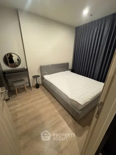 Cozy modern bedroom with stylish decor and comfortable bed in a chic apartment.