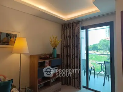 Cozy living room with modern decor and balcony view