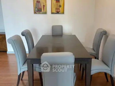 Elegant dining room with modern table and chairs, perfect for family gatherings.