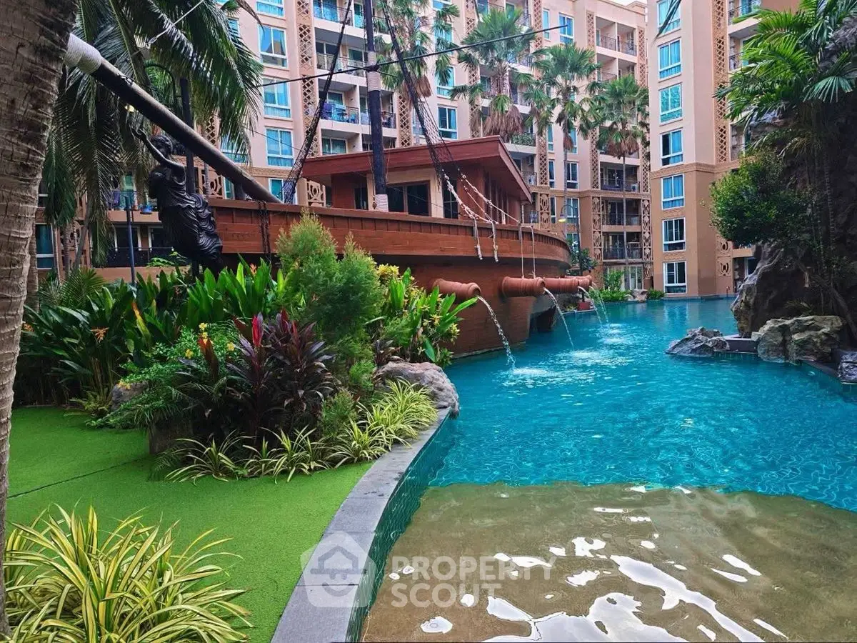 Luxurious apartment complex with stunning pool and lush greenery