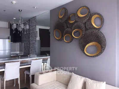 Modern living room with stylish decor and open kitchen layout