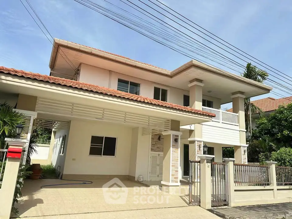 Charming two-story house with spacious driveway and modern exterior design in a serene neighborhood.