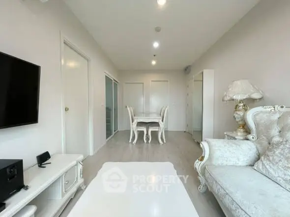 Elegant living room with classic white furniture and modern decor