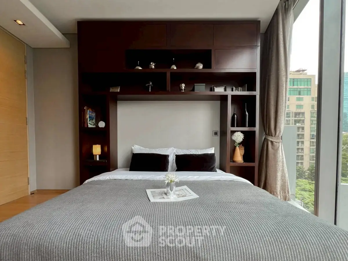 Modern bedroom with city view and stylish shelving unit
