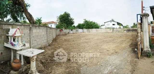 Spacious vacant land plot ready for development in a serene neighborhood.