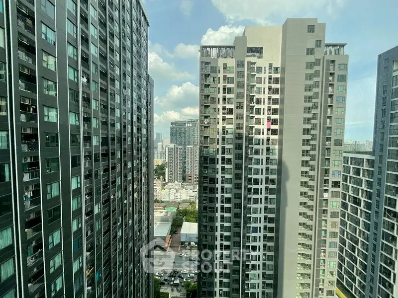 Stunning cityscape view from high-rise residential buildings with clear skies.
