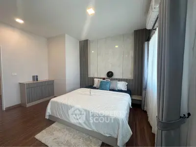 Spacious modern bedroom with elegant decor and natural light