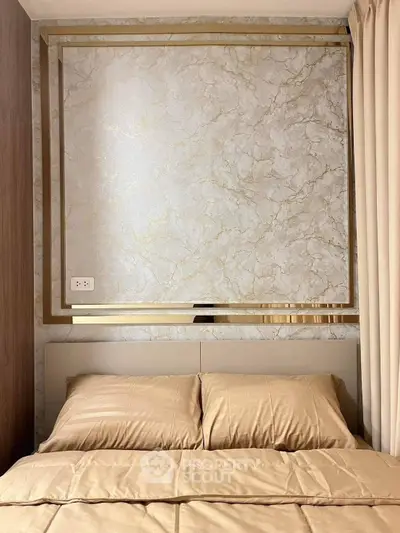 Luxurious bedroom with elegant marble accent wall and plush bedding