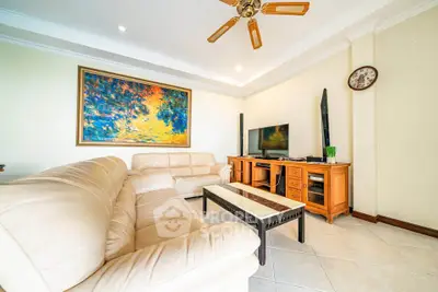 Spacious living room with elegant decor and modern entertainment setup