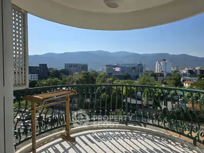 Stunning balcony view with mountains and cityscape, perfect for relaxation and enjoying the scenery.