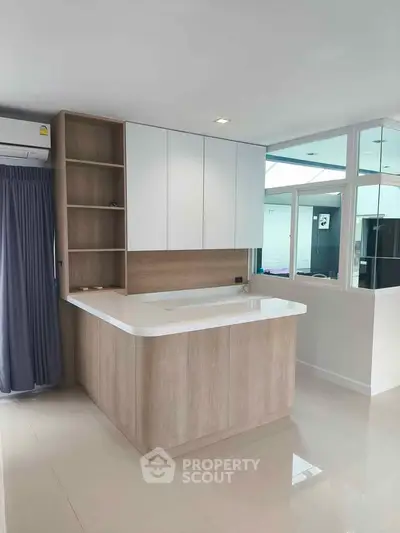 Modern kitchen with sleek cabinetry and open layout design