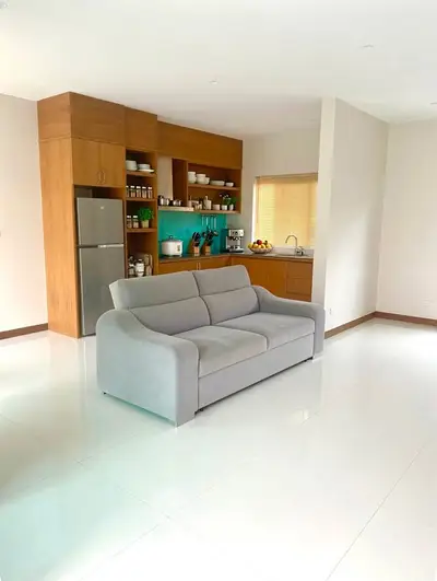 Spacious open-layout kitchen with modern appliances and cozy living area.