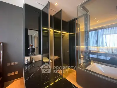 Luxurious modern bedroom with open closet and elegant black marble accents