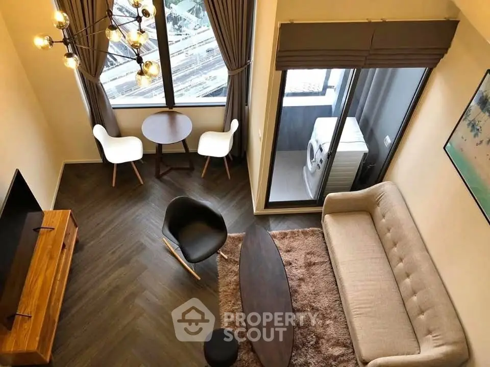 Modern living room with stylish furniture and large window view