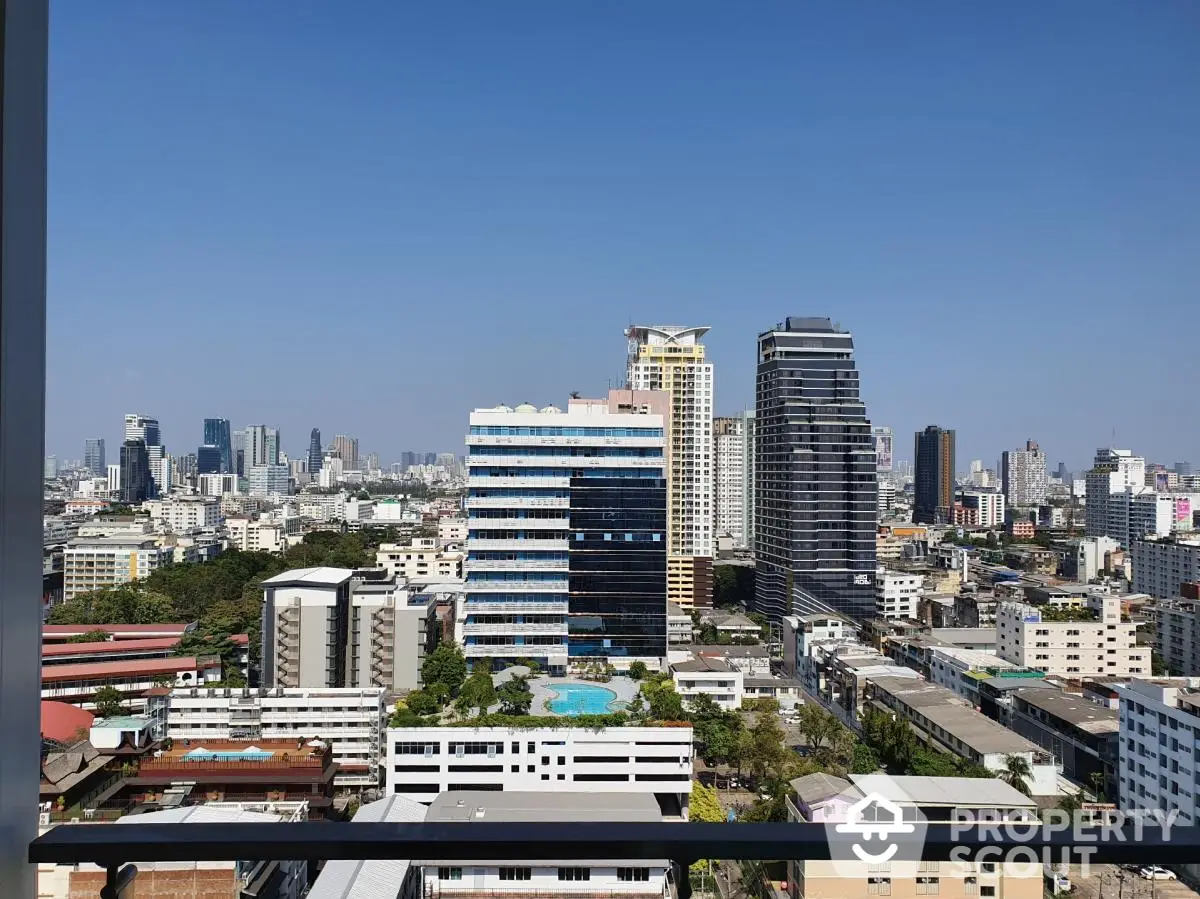 Stunning cityscape view from high-rise balcony showcasing urban skyline and modern architecture.