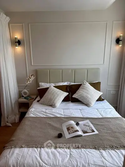 Elegant bedroom with stylish decor and cozy bedding, perfect for relaxation and comfort.