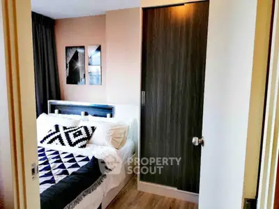 Cozy modern bedroom with stylish decor and ample natural light