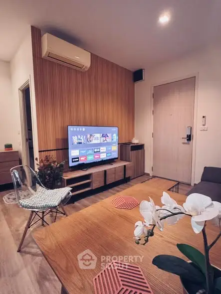 Modern living room with stylish decor and wall-mounted TV