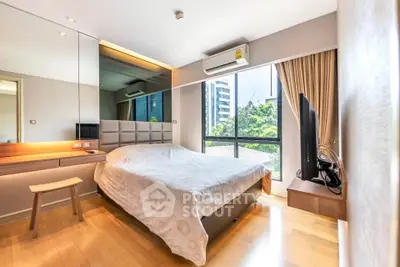 Modern bedroom with large window and city view, featuring stylish decor and natural light.