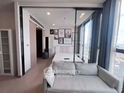 Modern bedroom with large windows and stylish decor in high-rise apartment