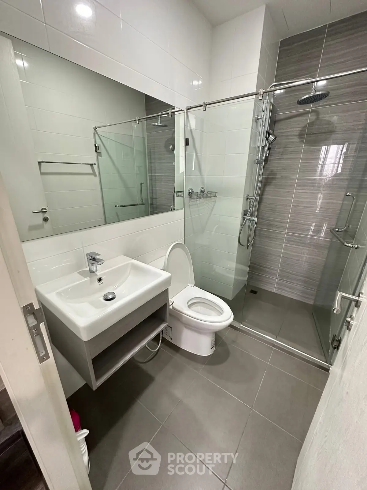 Modern bathroom with glass shower and sleek fixtures