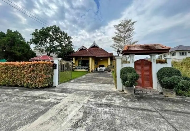 Charming suburban home with spacious driveway and lush greenery