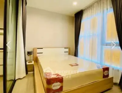 Modern bedroom with large windows and stylish decor