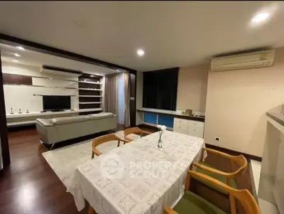 Spacious living and dining area with modern furniture and elegant decor