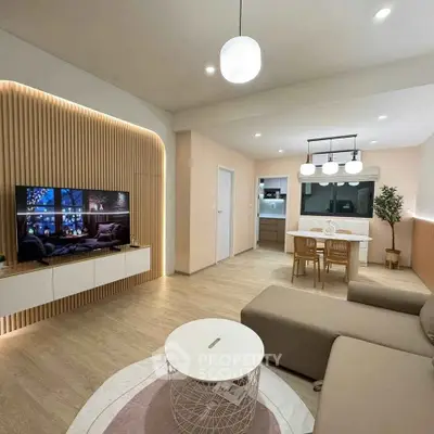 Modern living room with stylish decor and open kitchen layout