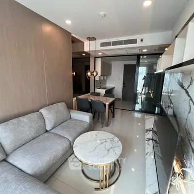 Modern living room with elegant marble table and stylish gray sofa