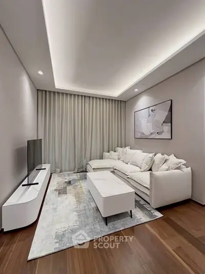 Modern living room with sleek furniture and ambient lighting, perfect for relaxation and entertainment.
