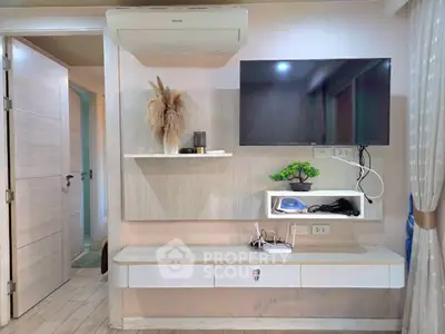 Modern living room with wall-mounted TV and stylish decor