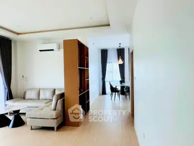 Spacious modern living room with elegant dining area and natural light