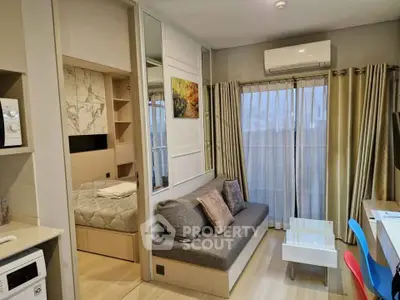 Modern studio apartment with cozy living area and stylish decor