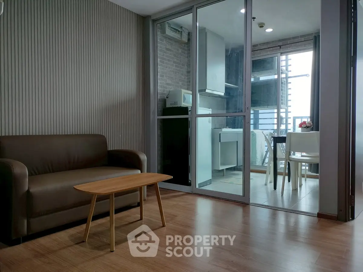 Modern living room with sleek design and open balcony view