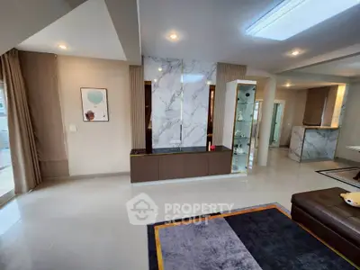 Spacious modern living room with marble accents and elegant decor