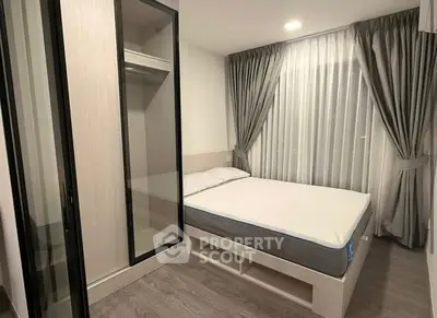 Modern bedroom with sleek wardrobe and cozy bed in stylish apartment.