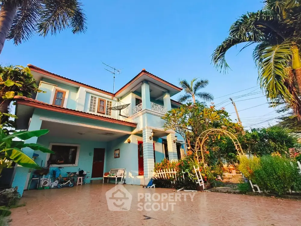 Charming two-story house with lush garden and spacious patio
