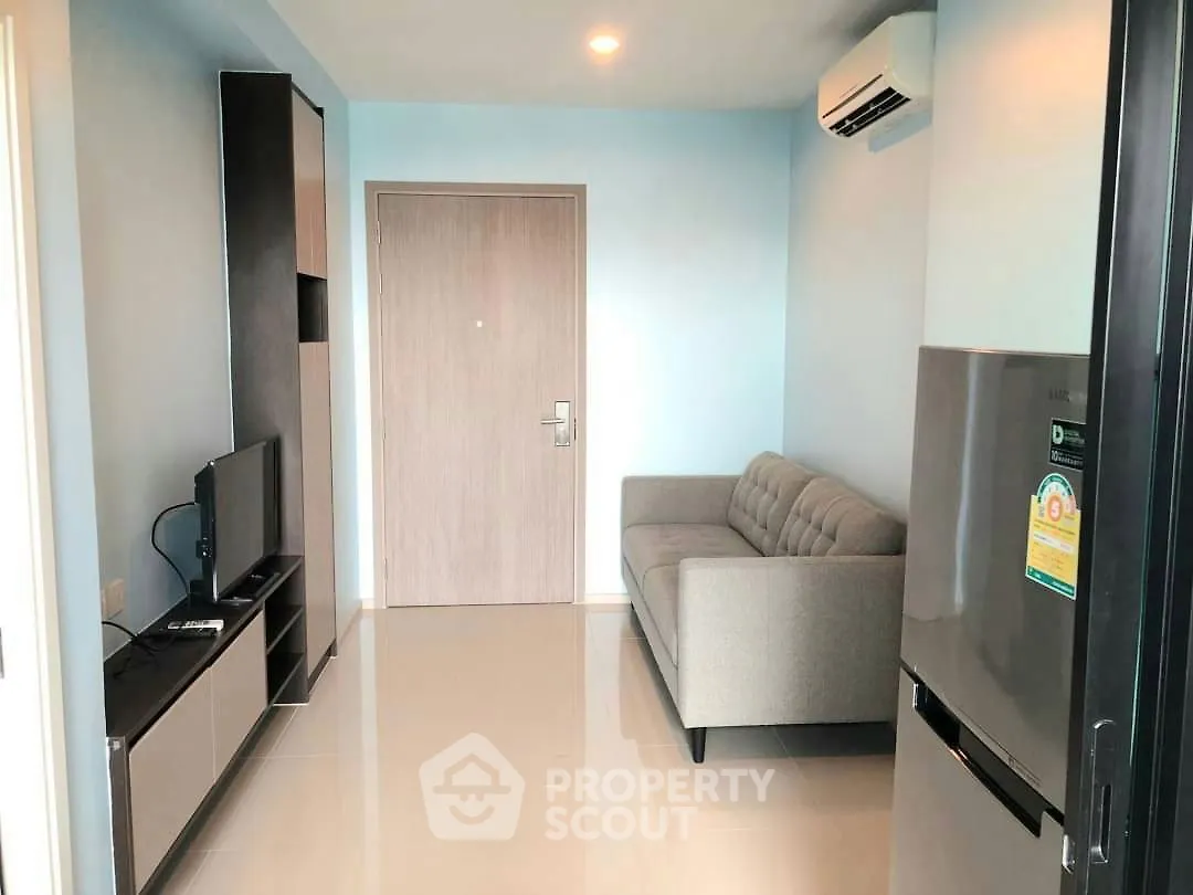 Modern living room with sleek furniture and air conditioning in a cozy apartment.