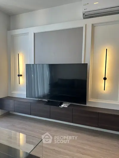 Modern living room with sleek TV setup and ambient lighting