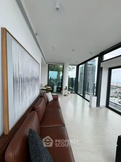 Luxurious corner unit living room with panoramic city views and modern decor.