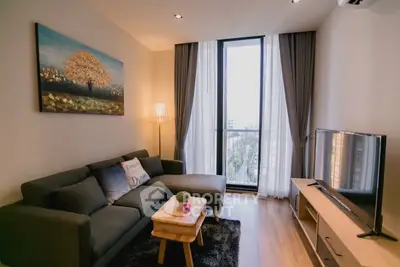 Cozy living room with modern decor and large window view