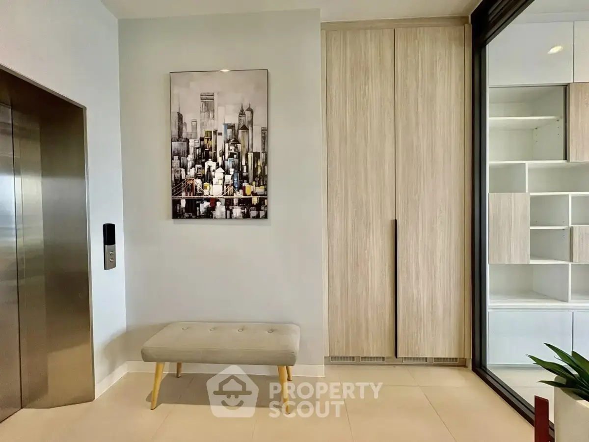 Modern apartment entrance with elevator and stylish decor