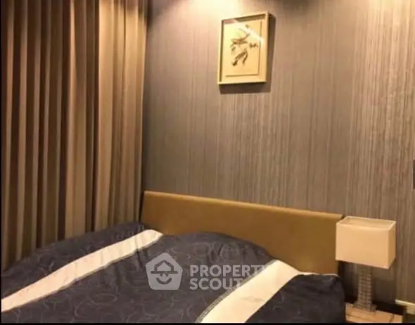 Cozy bedroom with elegant decor and soft lighting, perfect for relaxation.