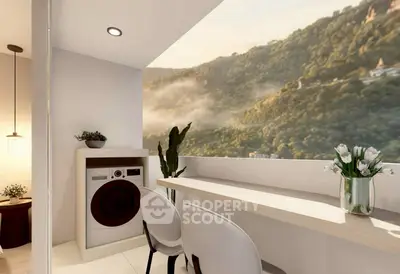 Modern balcony with stunning mountain view, featuring a cozy seating area and built-in laundry appliances.