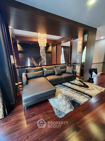 Luxurious living room with elegant decor and plush seating in a modern home.
